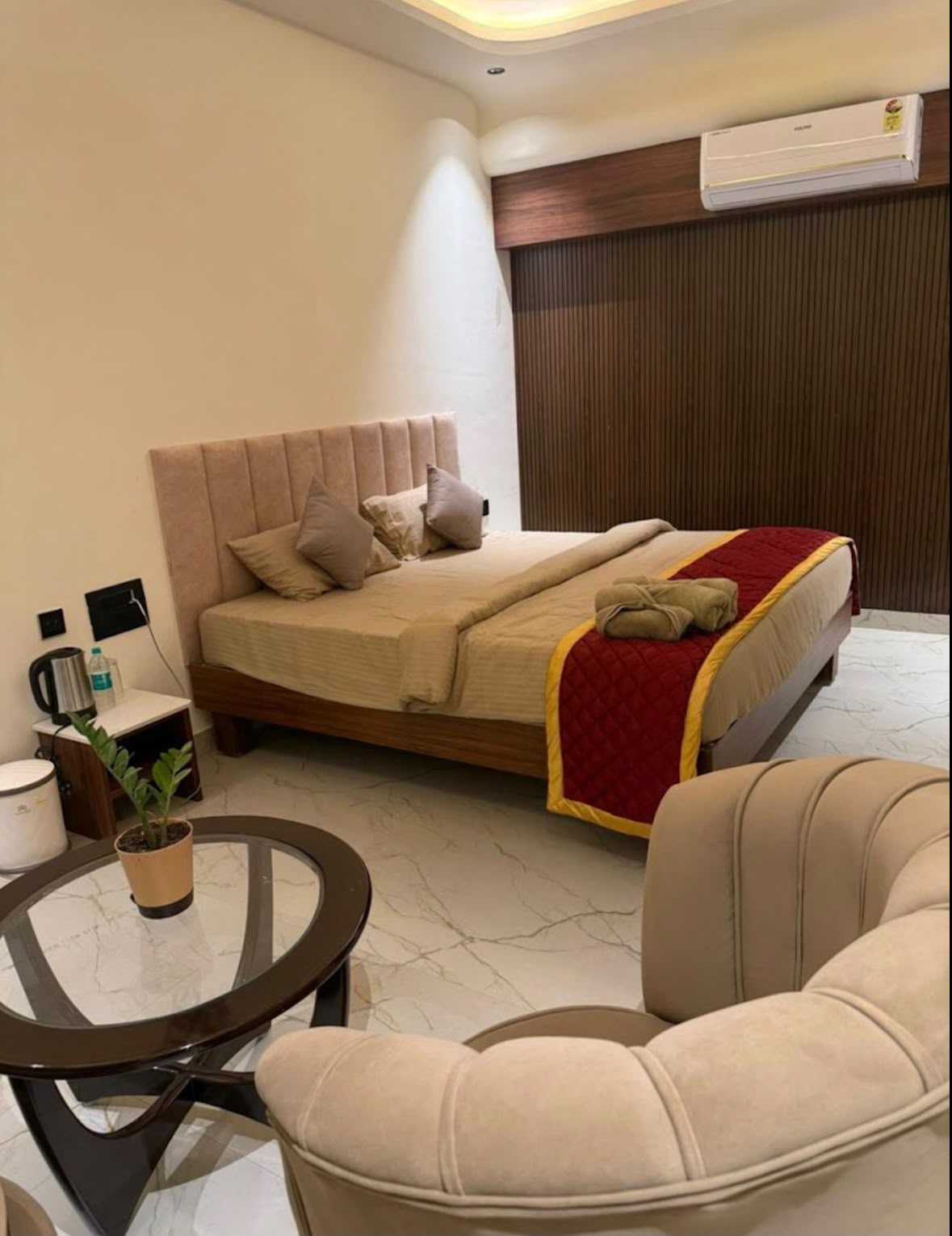 Client project suite with layered bedding and a red bed runner